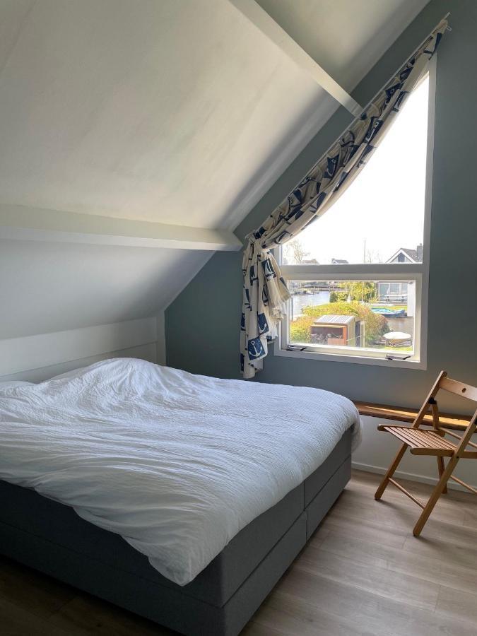 Vakantiehuis Aan Het Water Indijk Bagian luar foto